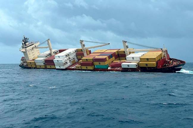This photograph taken and released on May 25, 2025 by the Indian Defence Public Relations Office (PRO) of Mumbai shows a Liberian-flagged container ship off India's southern coast of Kerala. A Liberian-flagged container ship with hazardous cargo has sunk off India's southern coast of Kerala, the navy said May 25, after rescuing all 24 crew members safely. - AFP PHOTO /Indian Defence Public Relations Office (PRO) of Mumbai - / HANDOUT