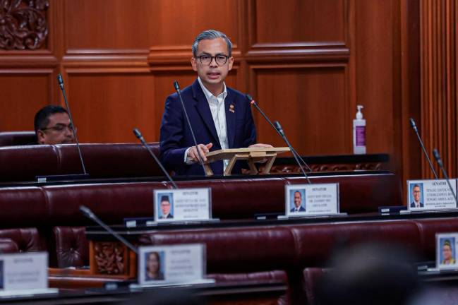 Communications Minister Fahmi Fadzil at the Dewan Rakyat, today. - Bernama pic