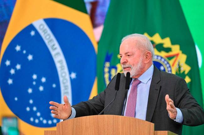 Brazil’s President Luiz Inacio Lula da Silva delivers a speech during the launch of a home renovation program for low-income families at Planalto Palace in Brasilia on October 20, 2025. - AFP