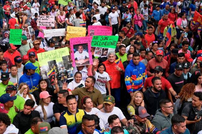 Venezuela’s Vice-President and Oil Minister Delcy Rodriguez marches with family members of Venezuelans deported from the U.S. to El Salvador to be imprisoned in the Terrorism Confinement Center (CECOT) prison, during a pro-government rally to demand their release, in Caracas, Venezuela.REUTERSpix