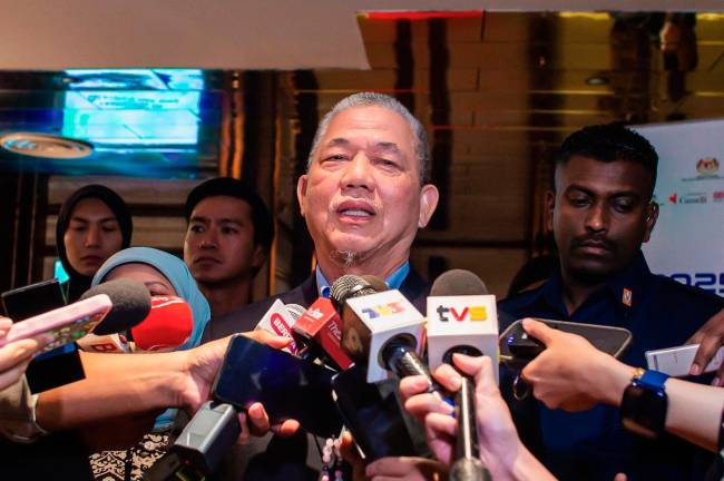 Deputy Prime Minister Datuk Seri Fadillah Yusof speaks to reporters after launching the National Action Plan on Women, Peace and Security here today. - Bernama
