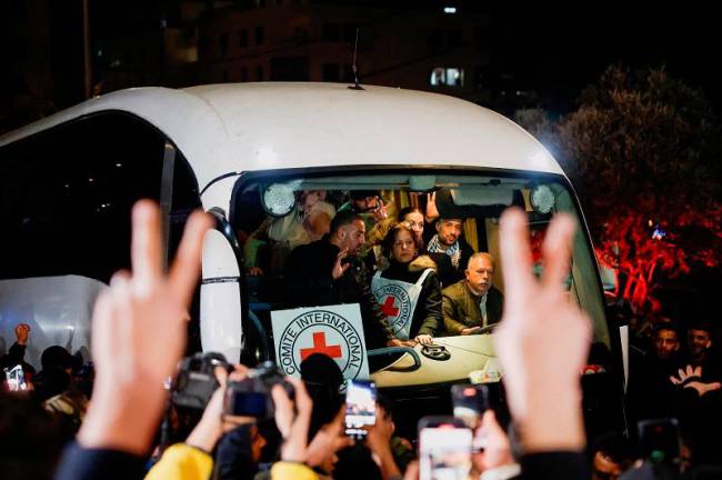 People gather to greet freed Palestinian prisoners, after they were released from an Israeli jail as part of a hostages-prisoners swap and a ceasefire deal in Gaza between Hamas and Israel, in Ramallah, in the Israeli-occupied West Bank, February 27, 2025. - REUTERS/Mohammed Torokman