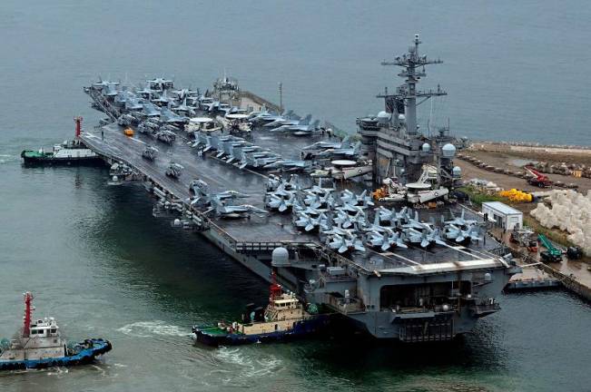 A nuclear-powered U.S. aircraft carrier, the Theodore Roosevelt, arriving in the South Korean port city of Busan earlier this month to take part in joint military exercises with the host nation and Japan. - REUTERSpix