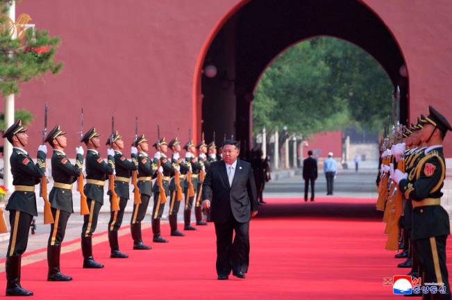 FILE PHOTO: North Korean leader Kim Jong Un arrives for a military parade to mark the 80th anniversary of the end of World War Two, in Beijing, China, September 3, 2025, in this picture released by North Korea’s official Korean Central News Agency. KCNA via REUTERS