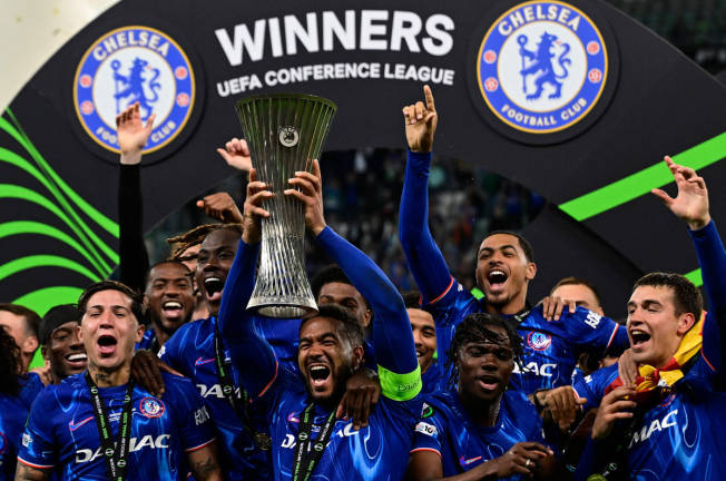 Chelsea’s English defender #24 Reece James lifts the trophy as he celebrates with teammates after the UEFA Conference League final football match between Real Betis and Chelsea FC in Wroclaw on May 28, 2025. - AFPpix