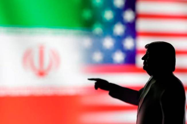 A 3D-printed miniature model depicting U.S. President Donald Trump, Iranian and U.S. flags in this illustration taken, April 17, 2025. - REUTERSpix