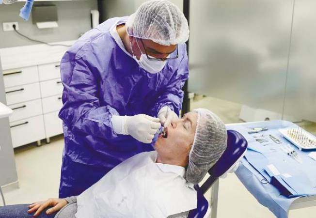 The job of a dental academician can be stressful as it entails striking a balance among various tasks such as teaching, research and clinical responsibilities. – REUTERSPIX