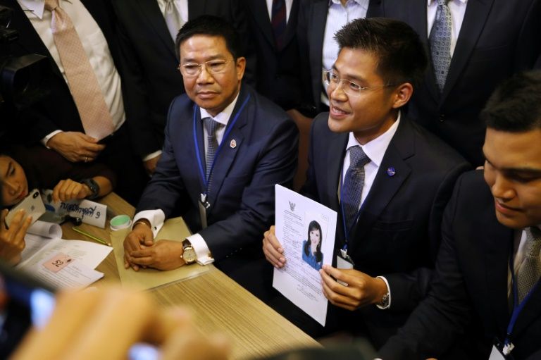 A party official holds a registration document bearing the image of Thai Princess Ubolratana, who will run for PM. — AFP
