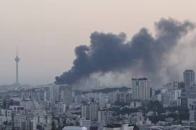Smoke rises following an Israeli attack on the IRIB building, the country’s state broadcaster, in Tehran, Iran, June 16, 2025. - REUTERS