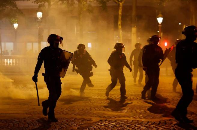 Riot police on the Champs Elysees avenue after Paris St Germain won the Champions League REUTERSpix