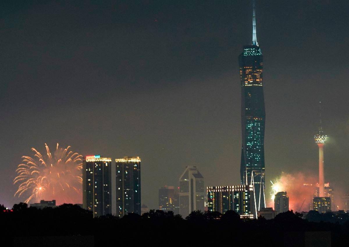 A view of Kuala Lumpur on Merdeka Eve as people welcome the 68th National Day with a dazzling fireworks display. - theSunpix