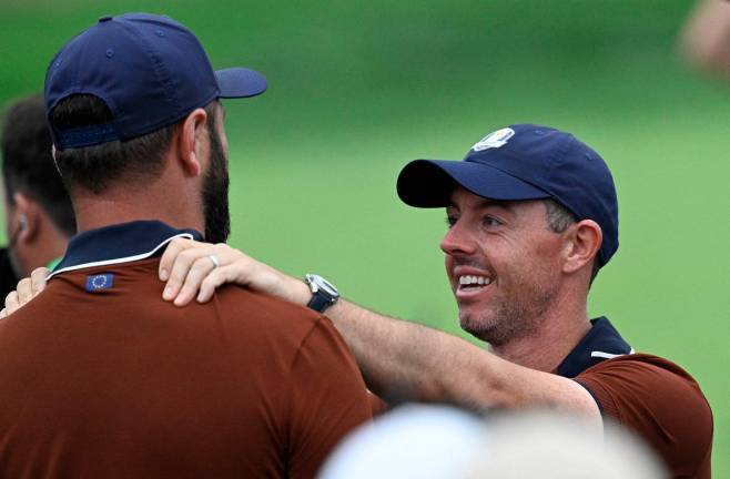 Team Europe’s Rory Mcllroy and Jon Rahm celebrate after the four-balls during the 2025 Ryder Cup - Bethpage Black Golf Course, Farmingdale, New York, United States. - Reuters