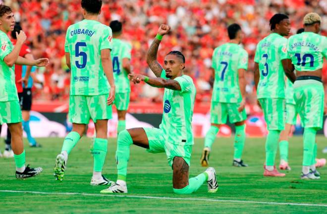 Barcelona’s forward Raphinha celebrates scoring the opening goal during the Spanish league football match between RCD Mallorca and FC Barcelona at Mallorca Son Moix Stadium in Palma de Mallorca. - AFP