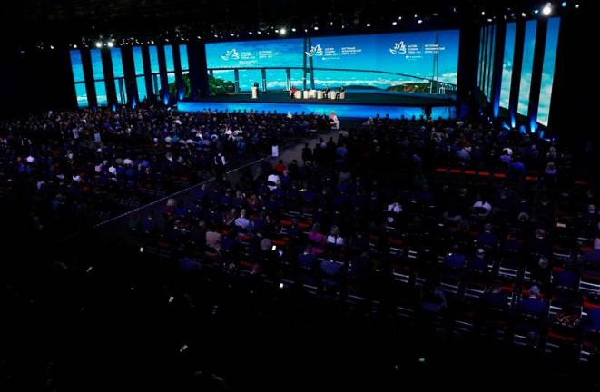 In this pool photograph distributed by the Russian state agency Sputnik, Russia's President Vladimir Putin, China's Vice President Han Zheng and Malaysia's Prime Minister Anwar Ibrahim attend a plenary session of the Eastern Economic Forum in Vladivostok on September 5, 2024. - Vyacheslav PROKOFYEV / POOL / AFP)