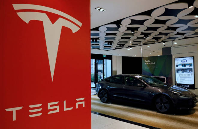 A Tesla model 3 car is seen in their showroom in Singapore October 22, 2021. - REUTERSpix