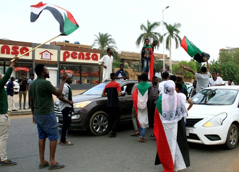Sudanese demonstrators celebrate in Khartoum on August 3, 2019. — AFP
