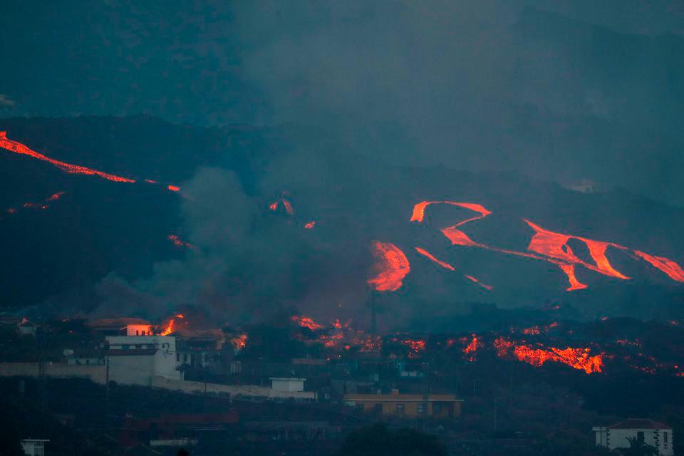 Lava spewed by the Cumbre Vieja volcano flows down a hill as it continues to erupt on the Canary Island of La Palma, as seen from Tajuya, Spain, October 17, 2021. REUTERSPix
