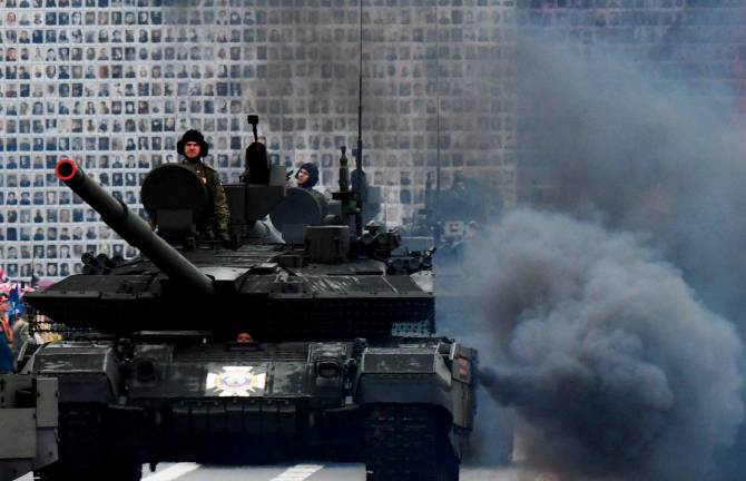 Russian military vehicles move on Dvortsovaya Square during the general rehearsal of the Victory Day military parade in central Saint Petersburg on May 7, 2025. Russia will celebrate the 80th anniversary of the Soviet Union’s victory over Nazi Germany in World War Two on May 9. - Olga MALTSEVA / AFP