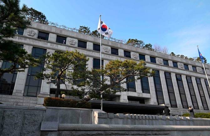 A South Korea flag flutters outside the Constitutional Court building in Seoul on December 16, 2024. South Korea’s constitutional court kicked off proceedings on December 16, over the impeachment of President Yoon Suk Yeol, who has been suspended from office over his failed bid to impose martial law. - Jung Yeon-je / AFP