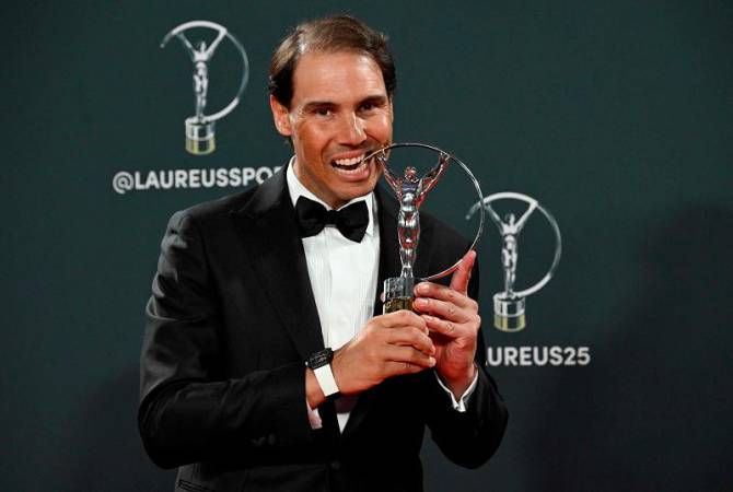 Spanish tennis player Rafael Nadal poses with his Sports Icone award during the 26th Laureus World Sports Awards gala in Madrid on April 21, 2025. - JAVIER SORIANO / AFP