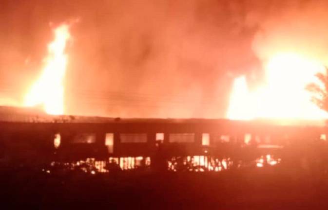 Fire engulfs Rumah Austin Ikew in Song. - Pic courtesy of Sarawak Fire and Rescue Dept