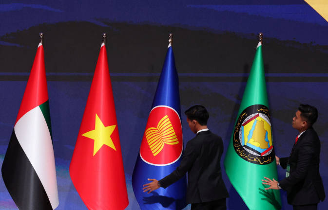 Officers arrange the ASEAN and Gulf Cooperation Council (GCC) flags during the ASEAN-GCC-China Summit at the Kuala Lumpur Convention Centre in Kuala Lumpur, Malaysia, May 27, 2025. - REUTERSpix