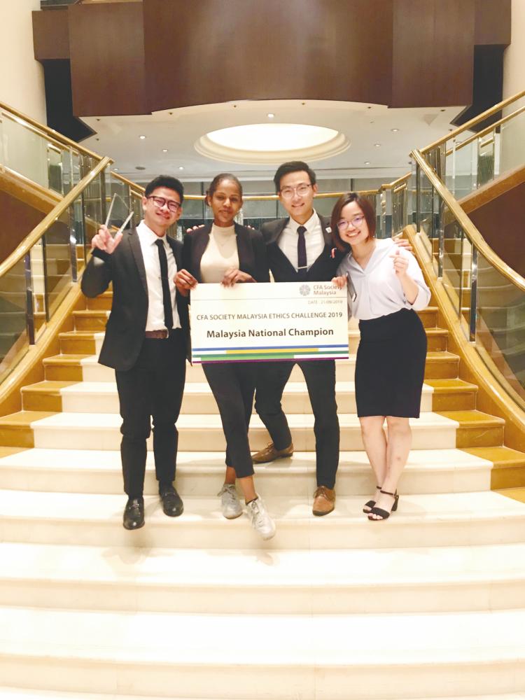 From left: Chin, Alaa Adil, Yap and Ong are all smiles after being announced as the Co-National Champions of the CFA Society Malaysia Ethics Challenge 2019.