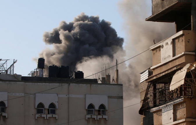 Smoke rises following an Israeli air strike on a house in Gaza City, June 27, 2025. - REUTERS