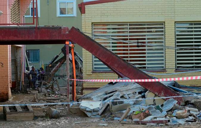 A picture taken on November 24, 2024 shows the site where a worker was killed after a roof collapsed at Luis Vives highschool of Massanassa, south of Valencia. A labourer working on repairs to a school near Valencia damaged in the deadly floods that ravaged eastern Spain last month was killed when a roof collapsed, authorities said on November 24, 2024. - JOSE JORDAN / AFPpix