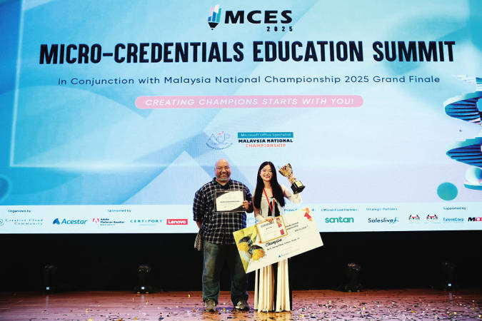 Wong with teacher-mentor Rizzham, after winning the Adobe Certified Professional (ACP) Malaysia National Championship 2025.