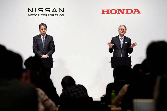 Makoto Uchida, president and CEO of Nissan Motor, and Toshihiro Mibe, Honda Motor president and CEO, attend their joint press conference in Tokyo, Japan March 15, 2024. - Kyodo via REUTERS