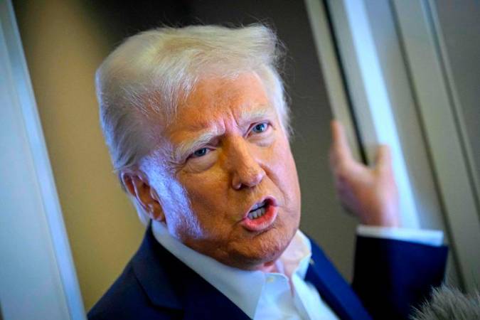 US President Donald Trump speaks with the press on board Air Force One after departing Las Vegas, Nevada, en route to Miami, Florida on January 25, 2025. After visits to disaster sites in North Carolina and California, the Vegas stop is more of a feel-good victory lap, as he lays out his plans to exclude tips from federal taxes -- an enormously popular move in a city built on the hospitality industry. - Mandel NGAN / AFP