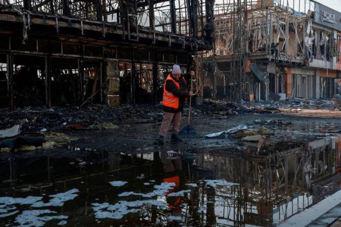 A municipal worker cleans an area at the site of a Russian drone strike, amid Russia’s attack on Ukraine, in Odesa, Ukraine March 21. REUTERSpix