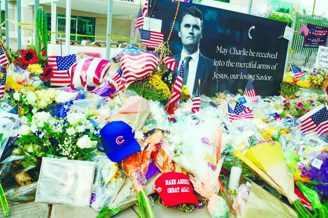 Flowers, photos and other items lie at a memorial for Kirk at the Turning Point USA headquarters in Phoenix, Arizona, US on Sept 12. – REUTERSPIC