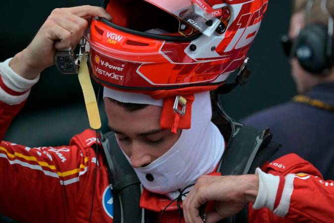 Ferrari's Monegasque driver Charles Leclerc takes off his helmet at the end of the sprint qualifying for the Formula One Sao Paulo Grand Prix at the Jose Carlos Pace racetrack, aka Interlagos, in Sao Paulo, Brazil, on November 1, 2024. - NELSON ALMEIDA / AFP