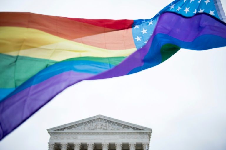 A rainbow flag flies outside the US Supreme Court on December 5, 2017. — AFP