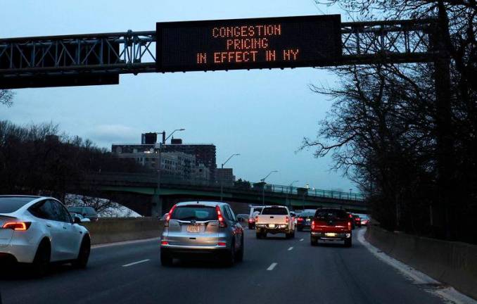 Vehicles pass a sign on the Henry Hudson Parkway announcing New York City’s congestion pricing program in effect charging drivers for entering the central business district in Manhattan below 60th street in New York City, U.S., January 6, 2025. Reuterspix