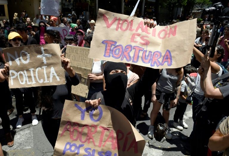 Demonstrators in Mexico City protest on August 12 the recent rape of two teenage girls. — AFP