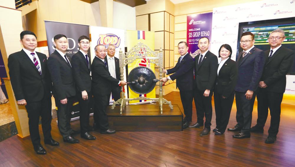 From left: M&amp;A Securities managing director of corporate finance Datuk Bill Tan, SDS director Datuk Albert Ding Choo Earn, CFO Tan Kee Meng, managing director Tan Kim Seng, directors Azahar Baharudin, Tan Kim Chai, Tan Kee Jin, Phang Sze Fui, Tan Yon Haw and M&amp;A Securities head of corporate finance Gary Ting at the listing ceremony yesterday.