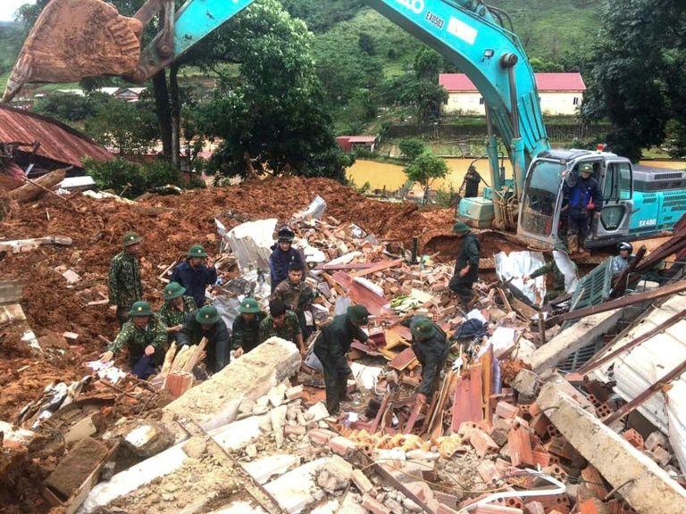 Rocks rained down on the barracks of a military station in Quang Tri province, with 22 soldiers believed to have been buried underneath thick mud. — AFP