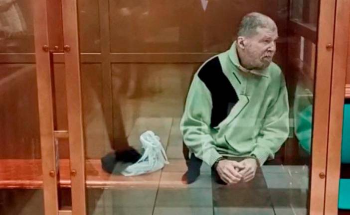 Stephen Hubbard, a U.S. citizen accused of fighting as a mercenary for Ukraine against Russia in the course of a military conflict, is seen inside an enclosure for defendants as he attends a court hearing in Moscow, Russia October 7, 2024, in this still image taken from video. - Moscow City Court Press Service/Handout via REUTERS