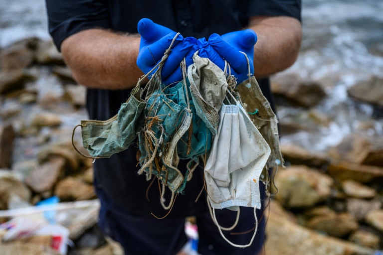 Conservationists are finding face masks washing up on Hong Kong’s shores in increased quantities. -AFP