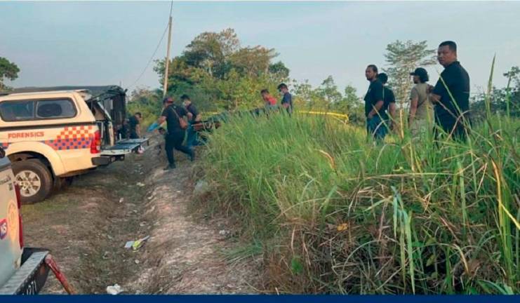The remains of the six-year-old being recovered by the police in Rompin, Negeri Sembilan. - Pic courtesy of Mohd Kamal Facebook