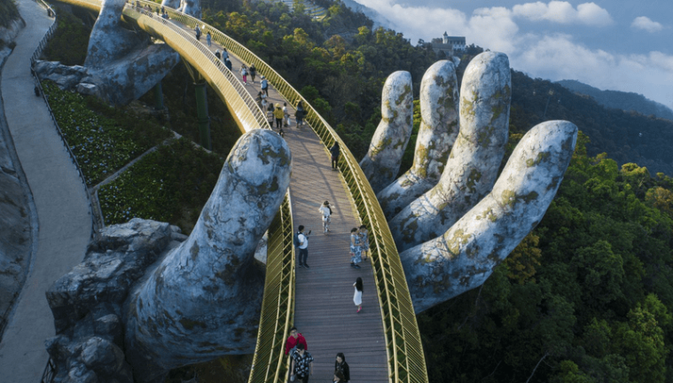 The Golden Bridge gracefully curves like a silk ribbon at Ba Na Hills.