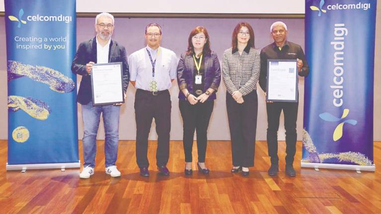 From left: CelcomDigi chief enterprise business officer Afizulazha Abdullah, Kamal, British Standards Institution Sdn Bhd managing director Evelyn Chye, TUV Nord (Malaysia) Sdn Bhd general manager Eva Soo, and CelcomDigi chief technology officer Kesavan Sivabalan at the ISO certifications conferment ceremony.