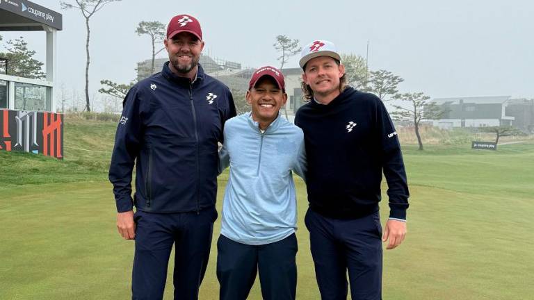 From left, Marc Leishman, Rizal Redzuan and Cameron Smith
