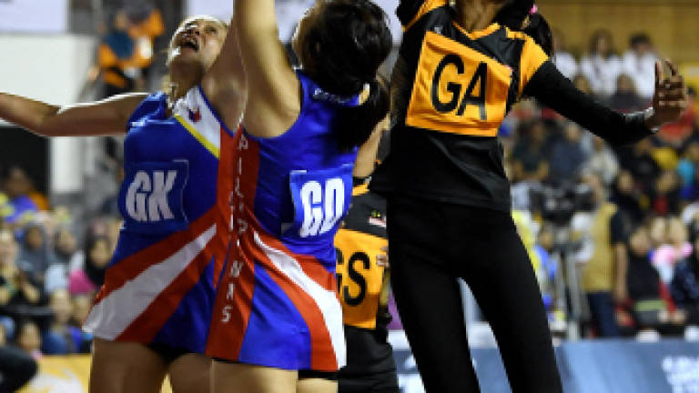 Malaysia crush Philippines 96-11 to top netball table