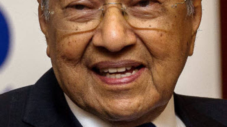 Mahathir jokes about retirement age, says it's now 95