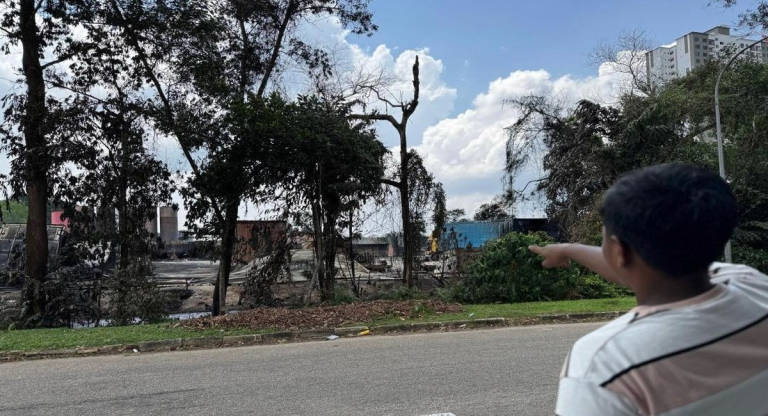 Aiman Abdullah, 23, had gone to a recycling centre to purchase a used water tank when the blaze broke out. - BERNAMA