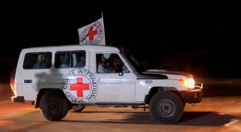 A Red Cross vehicle, as part of a convoy believed to be carrying hostages abducted by Hamas militants during the October 7 attack on Israel, arrives at the Rafah border, amid a hostages-prisoners swap deal between Hamas and Israel, in the southern Gaza Strip November 24, 2023. - REUTERSpix